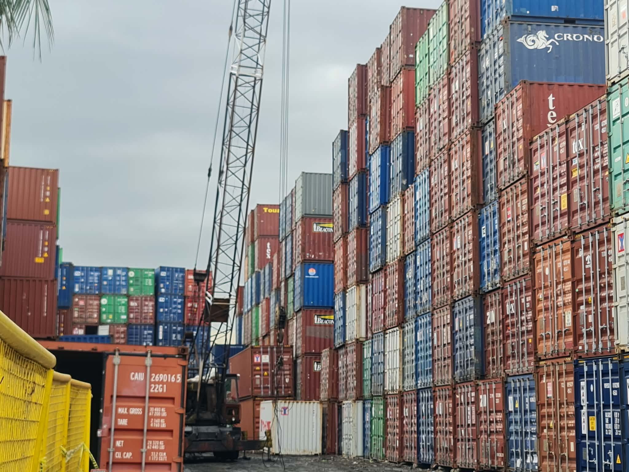 Container yard lane with crane and stacked units